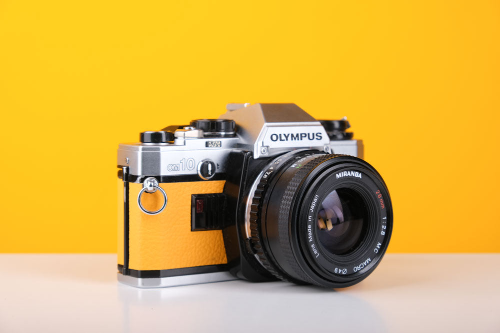 Olympus OM10 35mm SLR Film Camera in Yellow with 28mm f2.8 Lens