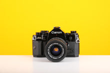 Load image into Gallery viewer, Canon A-1 35mm SLR Film Camera with Canon FD 35-70mm f3.5-4.5 Zoom Lens
