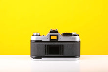 Load image into Gallery viewer, Canon AE-1 35mm SLR Film Camera with Canon FD 50mm f1.4 Lens
