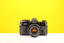 Load image into Gallery viewer, Canon AE-1 35mm SLR Film Camera with Canon FD 50mm f1.8 Lens Boxed
