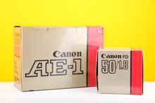 Load image into Gallery viewer, Canon AE-1 35mm SLR Film Camera with Canon FD 50mm f1.8 Lens Boxed
