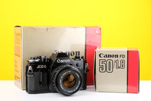 Load image into Gallery viewer, Canon AE-1 35mm SLR Film Camera with Canon FD 50mm f1.8 Lens Boxed
