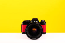 Load image into Gallery viewer, Contax 139 Quartz 35mm SLR Film Camera with Carl Zeiss Vario-Sonnar 28-85mm f3.3-4 Zoom Lens in Red
