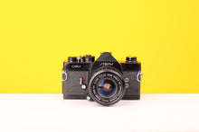 Load image into Gallery viewer, Cosina CSM 35mm SLR FIlm Camera with Vivitar Wide Angle Close Focus MC 28mm f2.8 Lens
