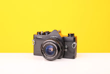 Load image into Gallery viewer, Cosina CSM 35mm SLR FIlm Camera with Vivitar Wide Angle Close Focus MC 28mm f2.8 Lens
