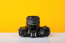 Load image into Gallery viewer, Minolta X-700 35mm SLR Film Camera with Minolta MD 50mm f1.7 Lens
