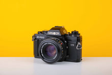 Load image into Gallery viewer, Minolta X-700 35mm SLR Film Camera with Minolta MD 50mm f1.7 Lens
