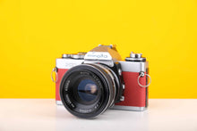 Load image into Gallery viewer, Minotla XD 35mm SLR Film Camera with Auto Tamron 35mm f2.8 Lens in Red
