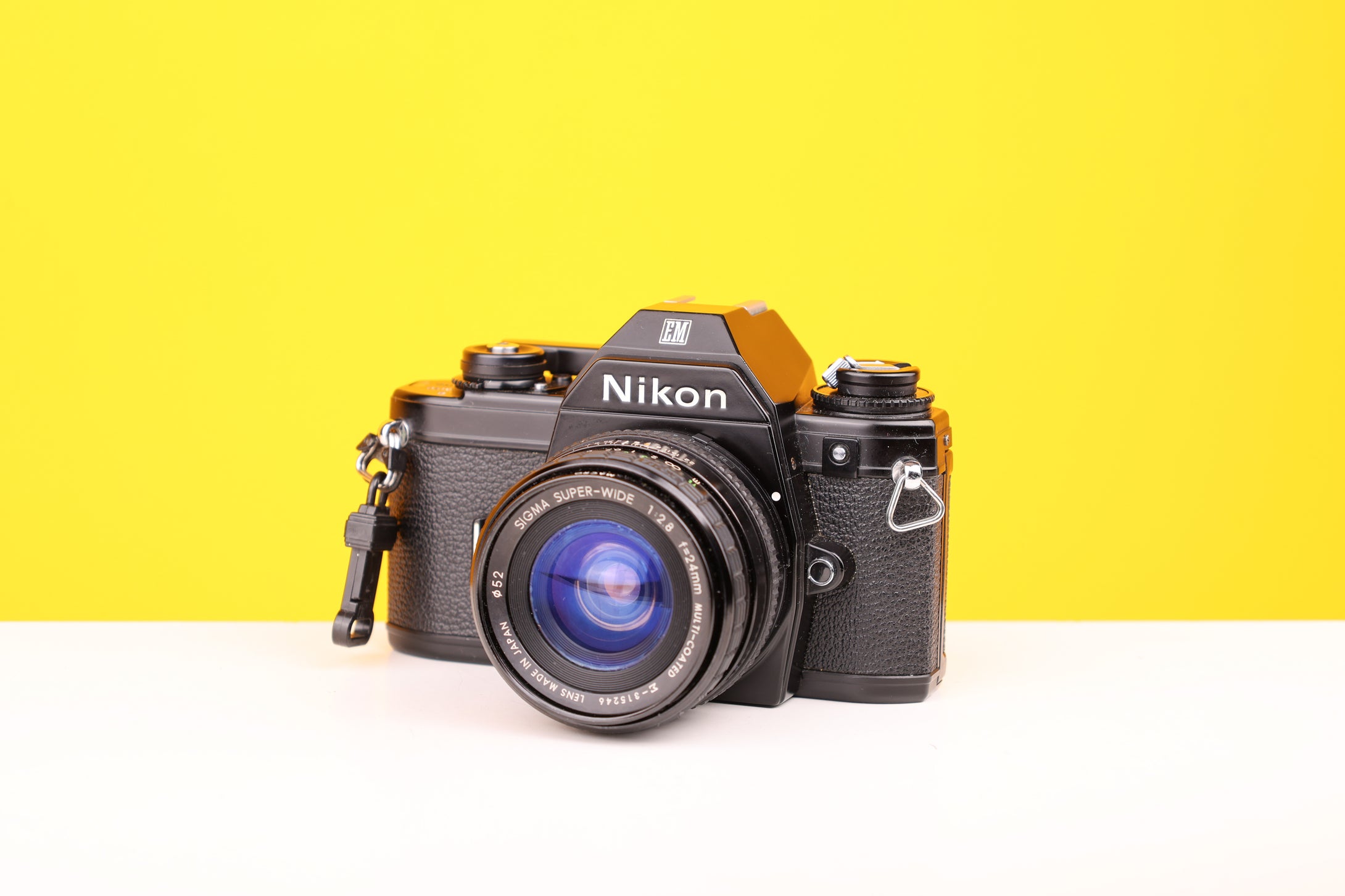 Nikon EM 35mm SLR Film Camera with Sigma Super-Wide Multi-Coated 24mm f2.8 Lens