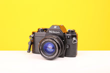 Load image into Gallery viewer, Nikon EM 35mm SLR Film Camera with Sigma Super-Wide Multi-Coated 24mm f2.8 Lens
