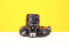 Load image into Gallery viewer, Nikon EM 35mm SLR Film Camera with Sigma Super-Wide Multi-Coated 24mm f2.8 Lens
