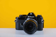 Load image into Gallery viewer, Nikon EM 35mm Film Camera with Micro-Nikkor Auto 55mm f3.5 Lens
