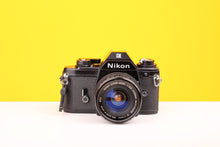 Load image into Gallery viewer, Nikon EM 35mm SLR Film Camera with Sigma Super-Wide Multi-Coated 24mm f2.8 Lens
