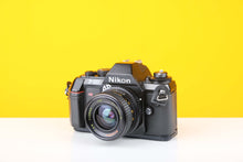 Load image into Gallery viewer, Nikon F-301 35mm SLR Film Camera with Bell&amp;Howell 28mm f2.8 Lens
