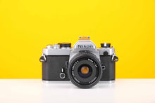 Load image into Gallery viewer, Nikon FM 35mm SLR Film Camera with Nikon Series E 35mm f2.5 Lens
