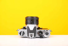 Load image into Gallery viewer, Nikon FM 35mm SLR Film Camera with Nikon Series E 35mm f2.5 Lens
