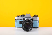 Load image into Gallery viewer, Olympus OM10 35mm Film Camera with Olympus Auto-S 50mm f1.8 MC Lens in Blue
