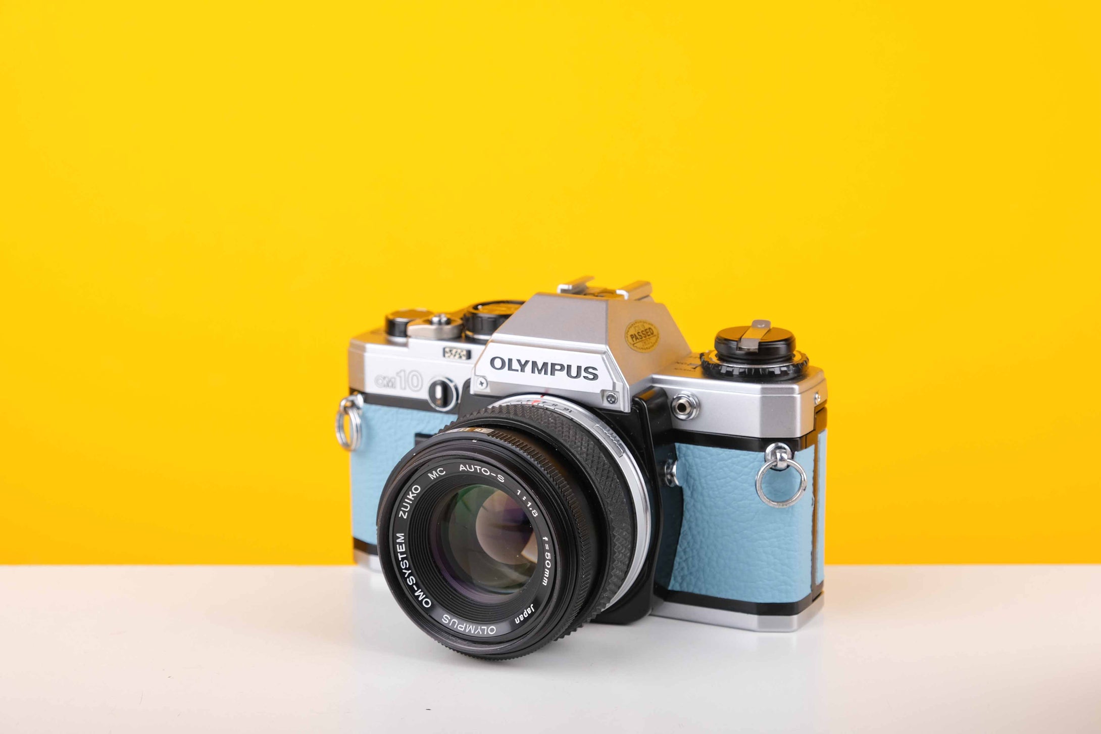 Olympus OM10 35mm Film Camera with Olympus Auto-S 50mm f1.8 MC Lens in Blue