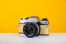 Load image into Gallery viewer, Olympus OM10 35mm SLR Film Camera with Olympus Zuiko OM-System Auto-S 50mm f1.8 Lens in Light Yellow
