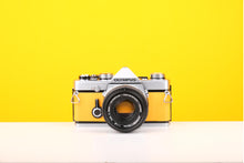 Load image into Gallery viewer, Olympus OM-1 35mm SLR Film Camera with Olympus OM-System Zuiko Auto-S 50mm f1.8 Lens in Yellow
