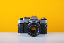 Load image into Gallery viewer, Olympus OM20 35mm SLR Film Camera with Zuiko 50mm f1.8 Lens
