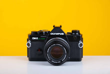 Load image into Gallery viewer, Olympus OM-2 Spot/Program 35mm Film Camera with Olympus 50mm f/1.8 Prime Lens
