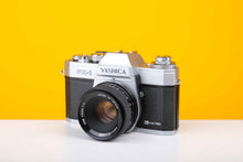 Load image into Gallery viewer, Yashica FX-1 35mm Film Camera with Yashica 55mm f/2 DSB Lens
