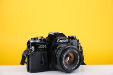 Load image into Gallery viewer, Canon AE-1 Black 35mm SLR Film Camera With 50mm F/1.8 Prime Lens
