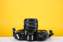 Load image into Gallery viewer, Canon AE-1 Black 35mm SLR Film Camera With 50mm F/1.8 Prime Lens
